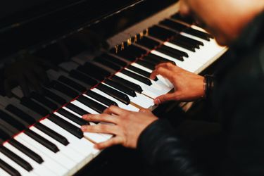 man plays on the piano